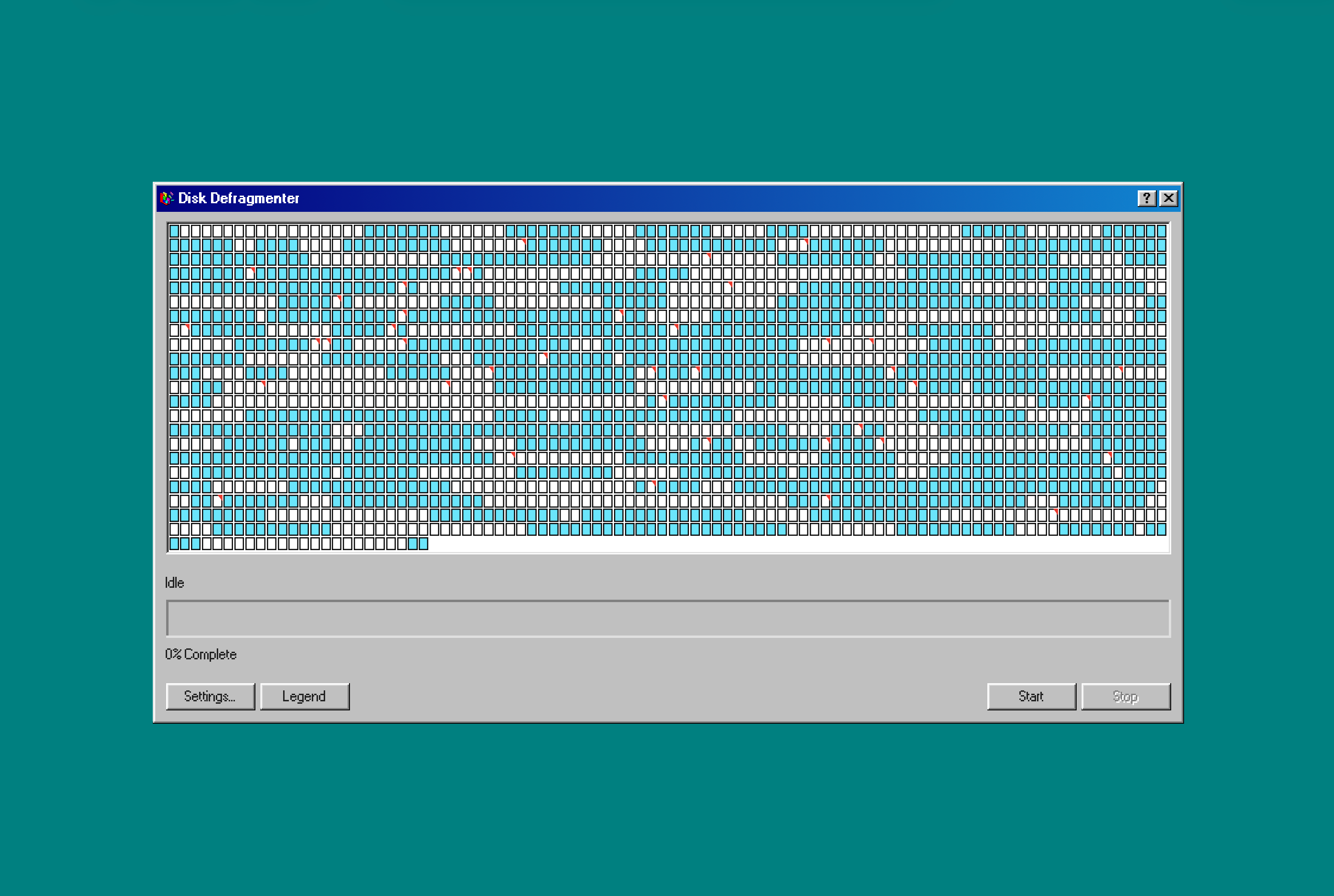 The Windows 98 Disk Defragmenter window showing a grid of fragmented disk clusters, ready to start